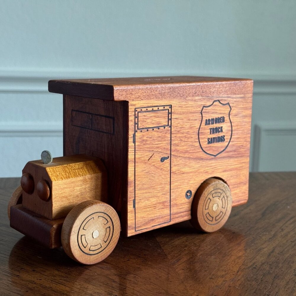 Vintage wooden piggy bank truck